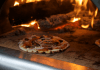 Choosing an Outdoor Pizza Oven Wood Fired Pizza photo by Emily Austin ( empowers_photography) on Unsplash