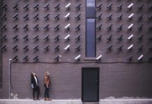 10 Benefits of Syncing Your Home and Cyber Security Two Person Standing Under Lot of Bullet Cctv Camera