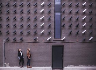 10 Benefits of Syncing Your Home and Cyber Security Two Person Standing Under Lot of Bullet Cctv Camera
