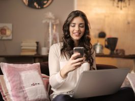 Want to Save Time? Buy Meat Online Macintosh HD:Users:andreforget:Downloads:woman-sitting-on-sofa-while-looking-at-phone-with-laptop-on-920382.jpg