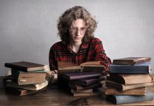 Appearing For Bar Exam? Follow These Steps Young male bookworm reading old book in library