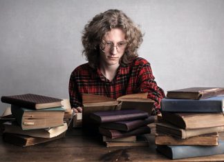 Appearing For Bar Exam? Follow These Steps Young male bookworm reading old book in library
