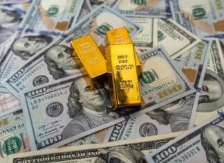 Innovative Gold Dealer Guides Investors Navigating Red Hot Market Gold bars on 100 us dollar note Premium Photo