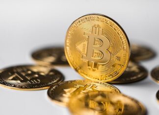 How does the travel industry benefit from the usage of Bitcoin?