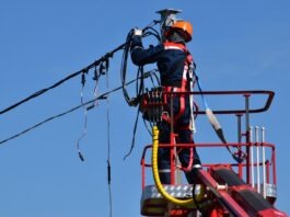 5 Tricks To Help You Survive During A Long Power Outage man in red and black jacket wearing orange helmet