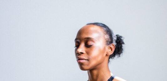 How your smartphone can help calm your life woman wearing black sports bra