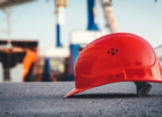 3 Technologies Making Construction Zones Safe & More Productive red hard hat on pavement