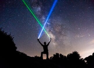 What Makes Laser Tag Game an Excellent Choice for Birthdays? man holding green and blue flashlights