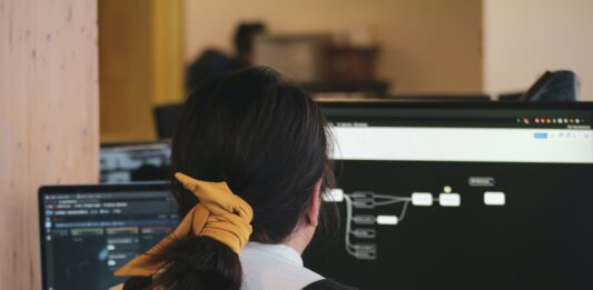 Benefits of Cloud-Based LMS woman in white long sleeve shirt