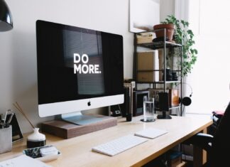 The Relationship Between Social Media and TV silver iMac with keyboard and trackpad inside room
