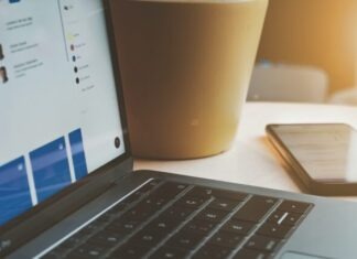 What are the various job roles in the Data Science and Business Analytics sectors? white laptop computer turned on beside brown paper cup