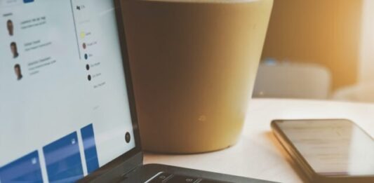 What are the various job roles in the Data Science and Business Analytics sectors? white laptop computer turned on beside brown paper cup