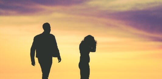 Are Divorces More Common Now than 20 years Ago? silhouette of man and woman under yellow sky