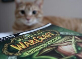 Getting the Wastewarped Deathwalker and Other Mounts in WoW brown tabby cat on green and white textile