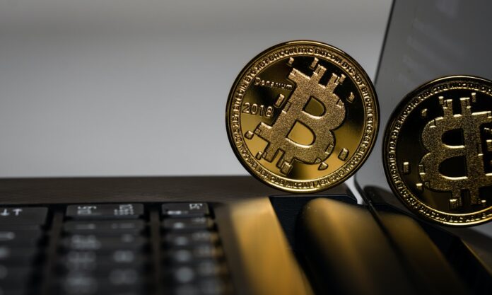 Photo by Aleksi Räisä two gold Bitcoins