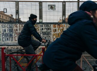 The Beginners Guide on How to Learn Italian From Scratch man in black jacket riding red bicycle