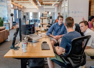 What You Should Know About Hiring Dedicated Developers three men sitting on chair beside tables