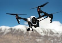 Mistakes to Avoid While Buying Remote Control Helicopters white and black quadcopter hovering under blue skies