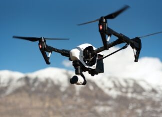 Mistakes to Avoid While Buying Remote Control Helicopters white and black quadcopter hovering under blue skies