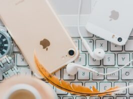 How To Use Face ID To Unlock iPhone While Wearing a Mask gold iPhone 7 beside white Apple EarPods and silver iPhone 5s