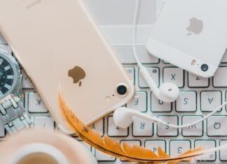 How To Use Face ID To Unlock iPhone While Wearing a Mask gold iPhone 7 beside white Apple EarPods and silver iPhone 5s