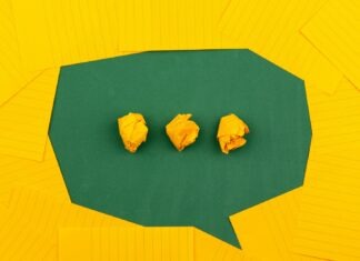 How Can Text to Speech Support the Learning Process? three crumpled yellow papers on green surface surrounded by yellow lined papers