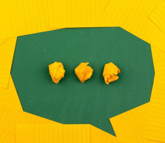 How Can Text to Speech Support the Learning Process? three crumpled yellow papers on green surface surrounded by yellow lined papers