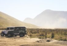 How To Prepare Your Jeep for Spring two gray and green SUV's on grass field