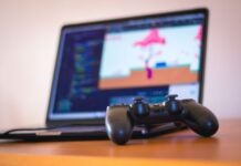The Best Google Chrome Games to Play (Ultimate Guide) black laptop computer beside controller on brown wooden surface