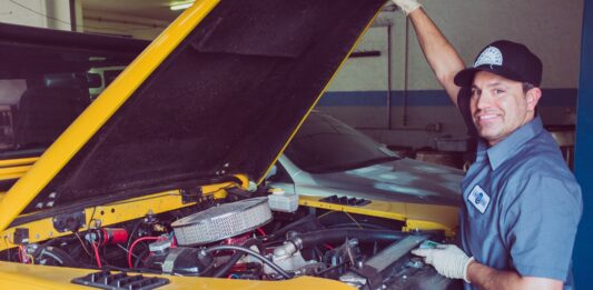How to Keep Your Truck Accessories and Parts Properly Maintained man holding open-wide car trunk