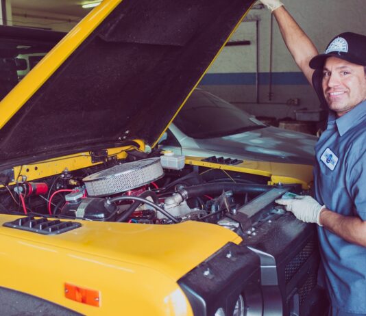 How to Keep Your Truck Accessories and Parts Properly Maintained man holding open-wide car trunk