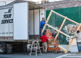 A Detailed Guide To Tipping Movers 2 boys in red shirt sitting on yellow metal bar