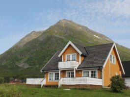 Steep Slope vs. Low Slope Roofing house on grass near mountain during day