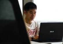 Tips for First-Year Exercise Science Majors man sitting while using Asus laptop