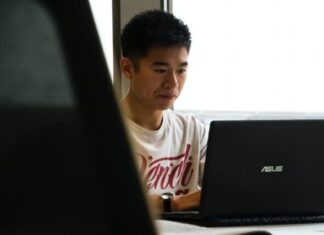 Tips for First-Year Exercise Science Majors man sitting while using Asus laptop