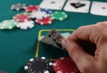 The 3 Casino Games Everyone Needs to Try person holding white and black playing cards