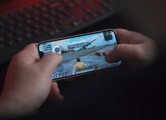 The Rise of the Gaming Phone person holding black samsung android smartphone