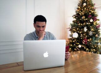 How Encryption is Used in Cloud Banking: The Benefits and Challenges man in gray crew neck shirt sitting in front of silver macbook