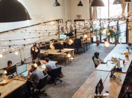 How to Scale IT Business in 2022 people sitting in front of computer monitors
