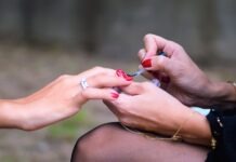 How Much Money Do Nail Techs Make? The Inside Scoop on Nail Technician Salary woman doing manicure