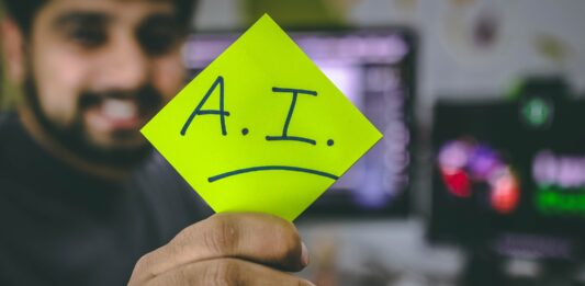How Is AI Reshaping Email Marketing In 2022? person holding green paper