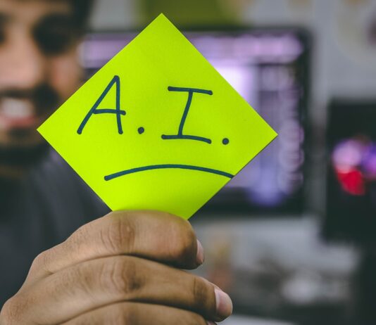 How Is AI Reshaping Email Marketing In 2022? person holding green paper