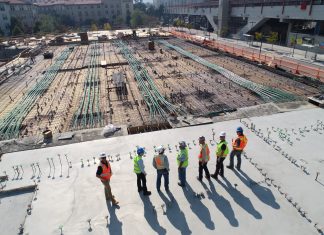 6 Tips for Winning More Construction Contracts seven construction workers standing on white field
