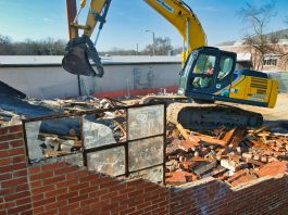 How To Find The Best Demolition Contractor In Your Area yellow and black excavator on brown brick wall during daytime