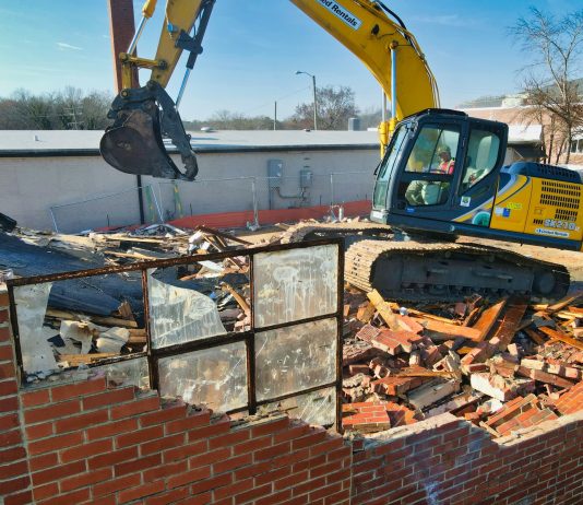 How To Find The Best Demolition Contractor In Your Area yellow and black excavator on brown brick wall during daytime