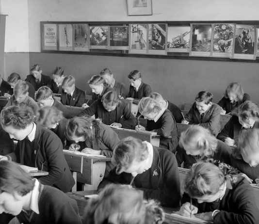 Charter School Programs for Santa Ana grayscale photo of people sitting on chair