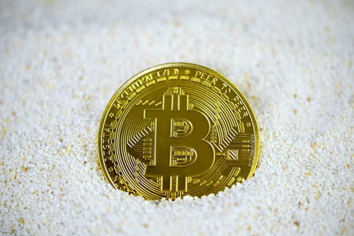 Photo by Kanchanara gold and black round coin