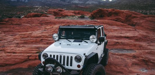 Is the Jeep Wrangler 4xe Hybrid a Real Jeep? white Jeep Wrangler on land