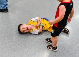 A Comprehensive Guide To Child Injury Lawsuits 2 boys lying on the ground
