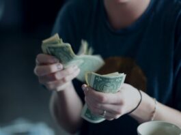The Digital Currency System Assists in Getting More Cash focus photography of person counting dollar banknotes
